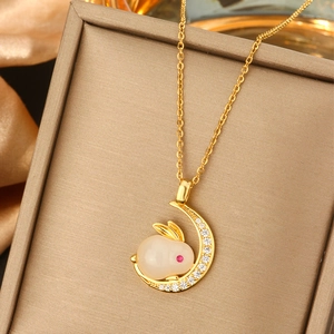 Elegant gold titanium steel necklace featuring a moon and rabbit pearl pendant in a gift box
