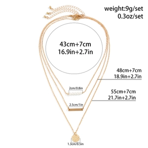 Detailed layered necklace size chart showing three gold chains with pearls and metal pendants