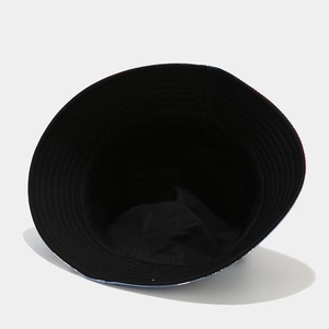 Interior view of the reversible sun hat showing the smooth black fabric lining detail