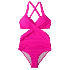 Detail of bright pink one-piece swimsuit with cross neck and side waist cut-outs