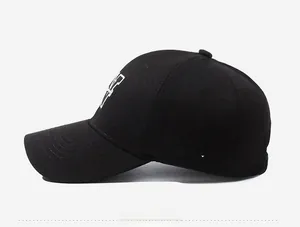 Side view of black cotton baseball cap with white W-O-W letter embroidery detail