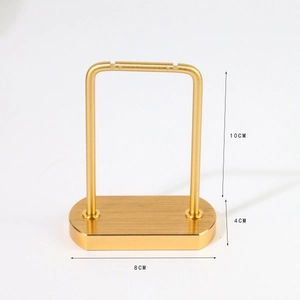 Golden brushed metal jewelry display stand with dimensions 10cm height and 8cm oval base