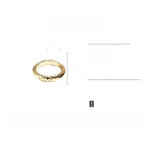 Detail view of wave-textured gold ABS bangle with 8.5cm diameter and metallic finish