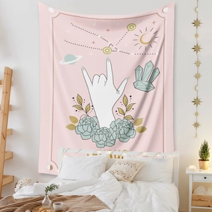 Cozy bedroom setting featuring a Bohemian tapestry with mystic moon and stars prints