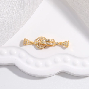 Close-up of a gold-plated S925 sterling silver jewelry clasp set with sparkling zircons