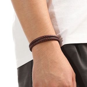 Detail of burgundy double-layer braided leather bracelet with magnetic alloy clasp