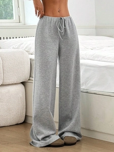 Detail of grey wide-leg lounge pants with adjustable drawstring waist for women