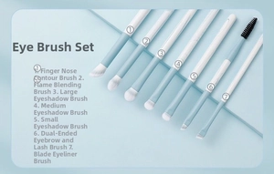 Macro shot of 7 professional blue eye makeup brushes with soft synthetic bristles