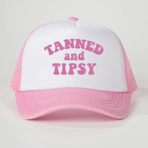 Detail of pink and white mesh trucker hat with TANNED and TIPSY text print