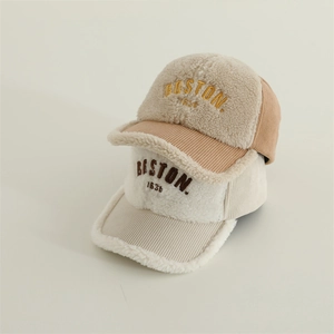 Detailed close-up of thick lamb wool and corduroy baseball caps with Boston embroidery