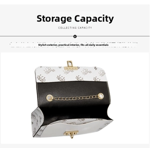 Detail view of mini printed crossbody bag with gold chain and interior storage space