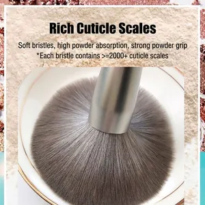 Large fluffy powder brush with silver metallic handle and soft gradient bristles