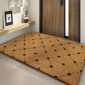 Close-up of coconut fiber entrance mat with black diamond pattern and flower motifs