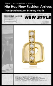 Detailed view of hip hop single tooth gold grillz inlaid with five round cubic zirconia