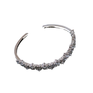 Elegant irregular zircon open bangle in silver finish with sparkling rectangular crystals