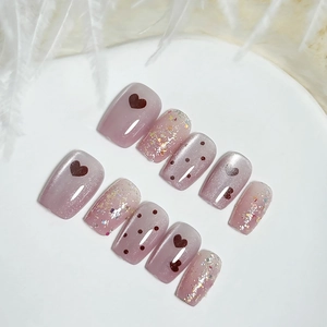 Handmade gradient mauve cat-eye press-on nails with glitter and heart pattern