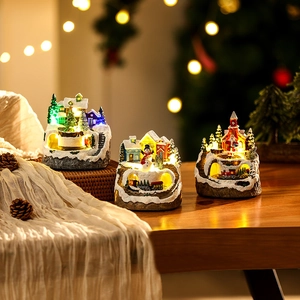 LED lighted Christmas resin house scene with Santa Claus and a miniature train on wood