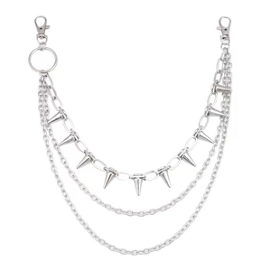Detailed view of silver triple-layer punk pants chain with metallic spikes and lobster clasps