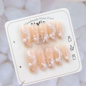 Pink gradient press-on nails with marble texture and elegant pearl accents in size S