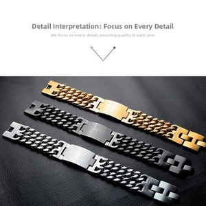 Detail of double-layer stainless steel chain bracelets with cross engraved plates