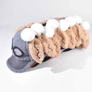 Detailed close-up of a plush cat bus toy with fuzzy texture and grey brown color