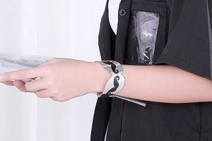 Polished silver stainless steel open bangle with black mustache pattern on model's wrist