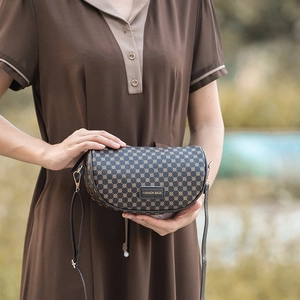 Classic dark brown printed saddle bag with round patterns and shoulder strap for women
