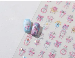 Detail of Sailormoon style nail stickers with pink bows, moon stars and magic wand designs