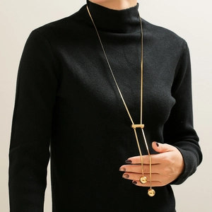 Elegant 18K gold plated titanium sweater necklace with hollow beads and long tassel style