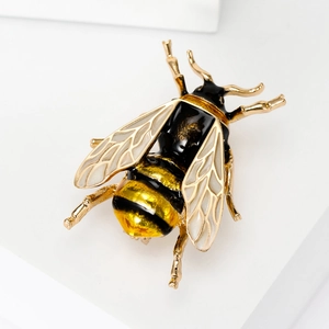 Fashionable alloy enamel bee brooch with gold plating and yellow accents on white background