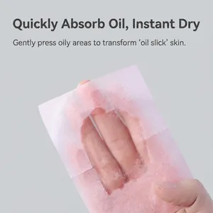 Portable facial oil blotting papers for women showing soft pink translucent sheets