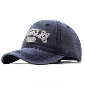 Vintage navy washed denim baseball cap with GELES 1994 embroidery and classic 6-panel design