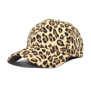 Detail shot of leopard print cotton baseball cap with curved brim and canvas texture