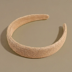Detailed close-up of beige straw woven headband showing natural texture and craftsmanship