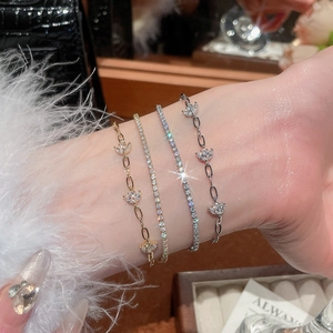 Close-up of elegant 18k gold plated double-layer zircon flower bracelets on wrist