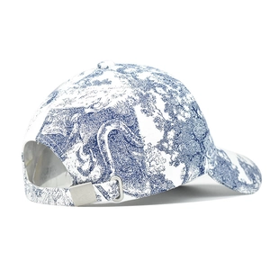 Detailed view of blue and white Toile de Jouy print and silver metal back strap adjuster