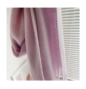 Close-up of soft purple mohair scarf featuring fuzzy texture and fringe tassels detail