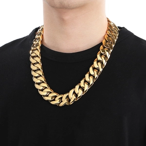 Men's 24mm gold plated stainless steel Cuban link chain necklace on male model