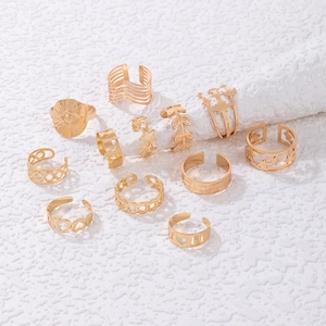11-piece set of gold-toned bohemian rings with star heart and leaf geometric designs