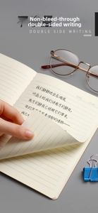 Detailed close-up of lined cream-colored eye-care paper with smooth handwriting texture