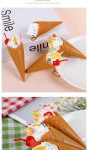 Close-up of artificial ice cream cone keychain with realistic waffle texture and toppings