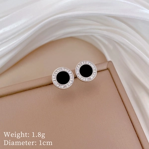 Detail view of round black agate earrings with rhinestone halo and size parameters