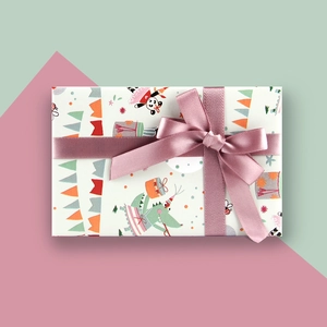 Detail of cartoon gift box with cute animal patterns and pink satin ribbon bow