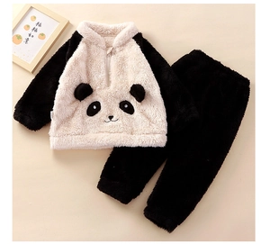 Close-up of soft flannel children's panda pajama set with plush ears and fuzzy texture