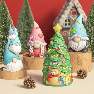 Christmas gnome and tree resin figurines with pine cones on a festive red backdrop