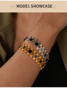 Detailed model shot of gold and silver hollow hexagon honeycomb bangle bracelets