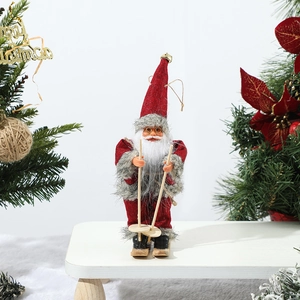 Detailed close-up of a skiing Santa Claus doll on a snowy background with festive decor