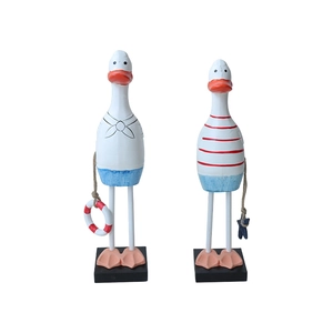 Set of two Mediterranean wooden duck figurines in navy uniforms with lifebuoy and starfish