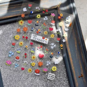 Colorful floral nail art stickers with tulips and hearts on a transparent background
