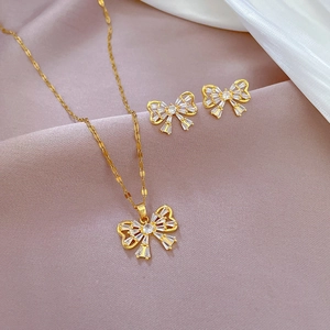 Elegant gold titanium butterfly jewelry set with sparkling micro-pave necklace and earrings